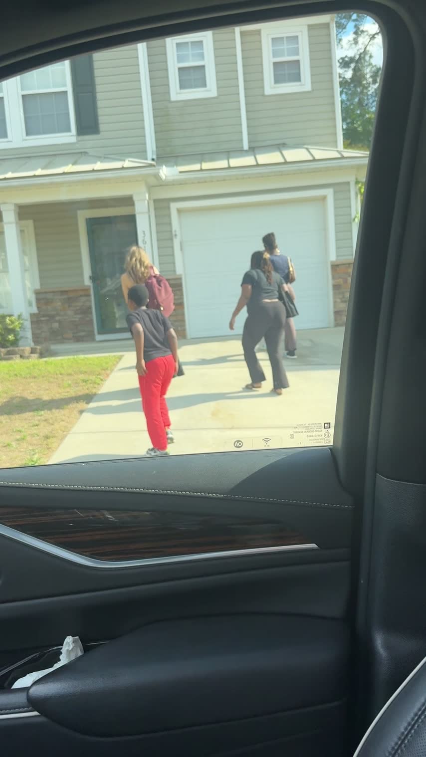 Christine arriving at a home with clients